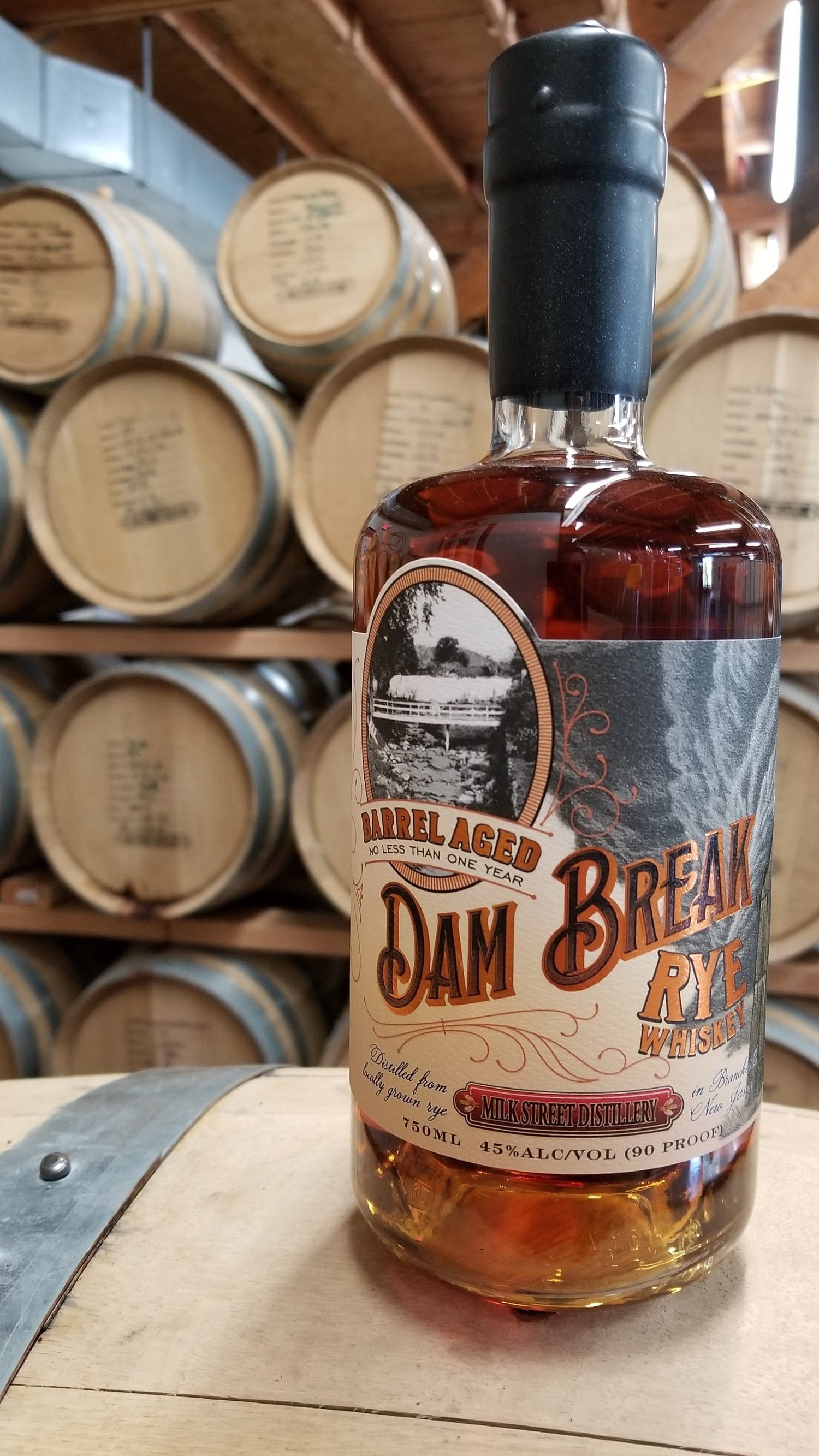 Dam Break Rye bottle and its illustrated label.